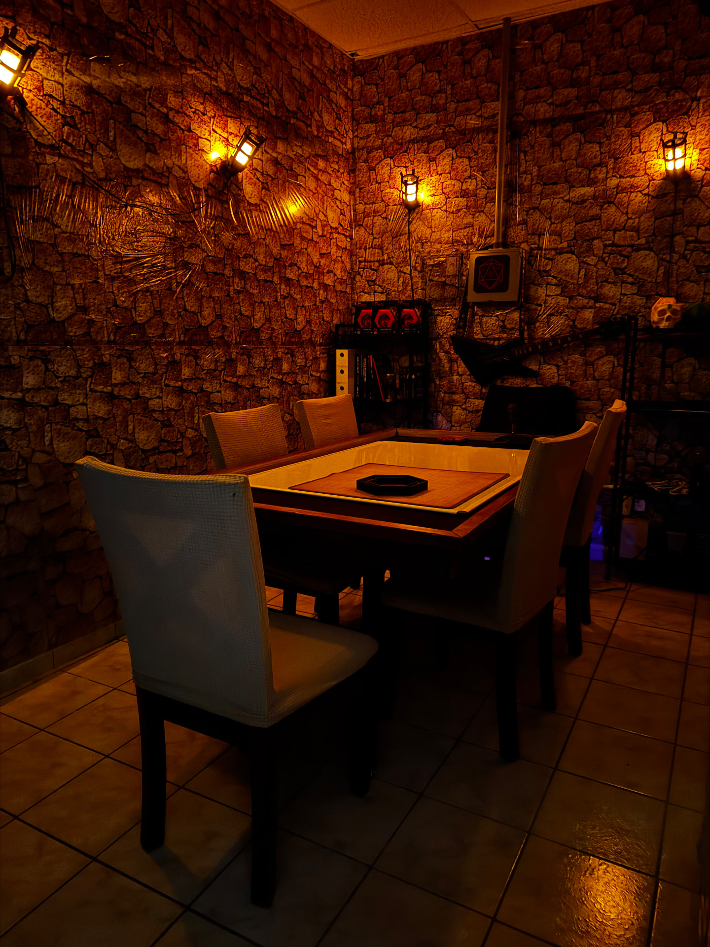 Torchlit stone walls and party seating around the VIP dungeon table